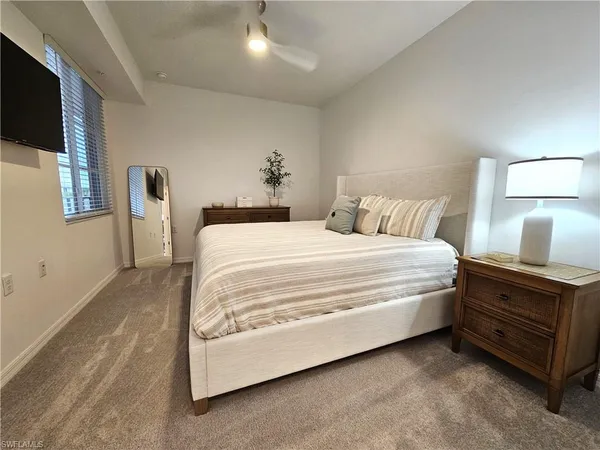 a bed room with a bed and a tv