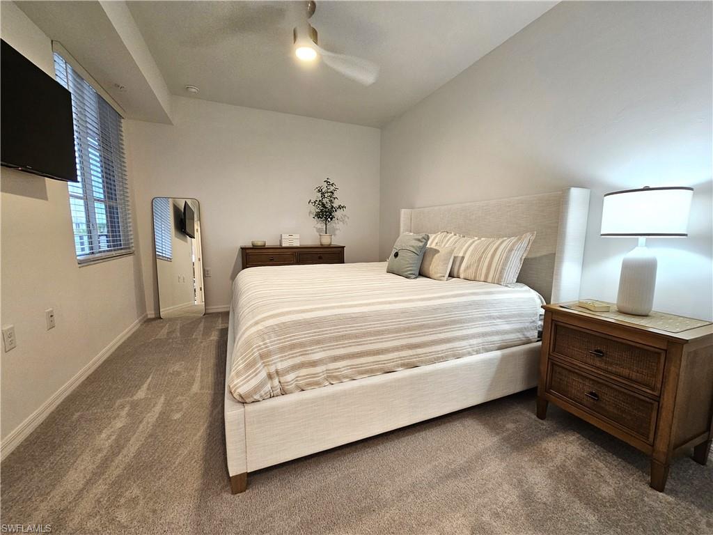 5749 Double Eagle Circle, Unit 4523 Immokalee, FL 34142 - Photo 8 of 47 a bed room with a bed and a tv