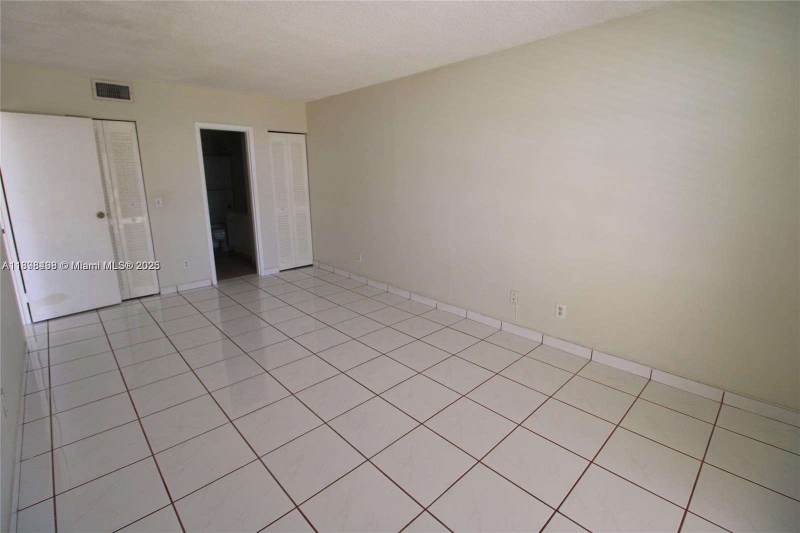 13499 Biscayne Boulevard, Unit 404 North Miami, FL 33181 - Photo 5 of 7 a view of an empty room