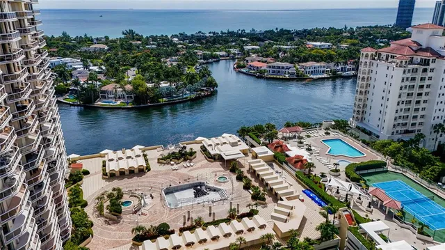 an aerial view of a house with a lake view