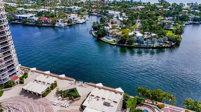an aerial view of a house with a lake view