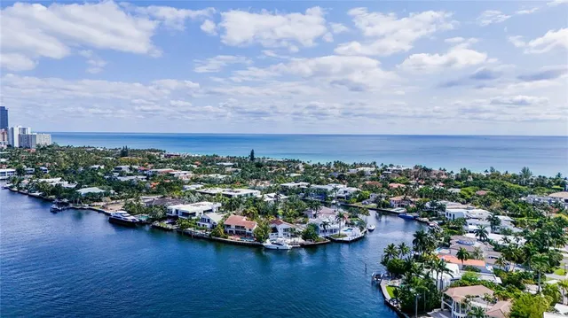 an aerial view of a houses with city view