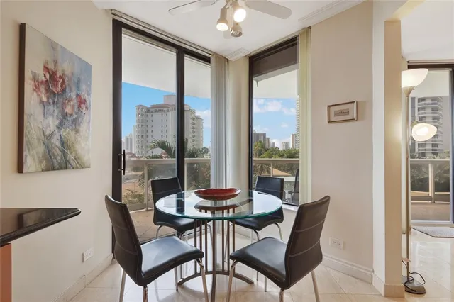 a dining room with furniture and window