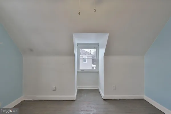 a bedroom with a bed and a chair