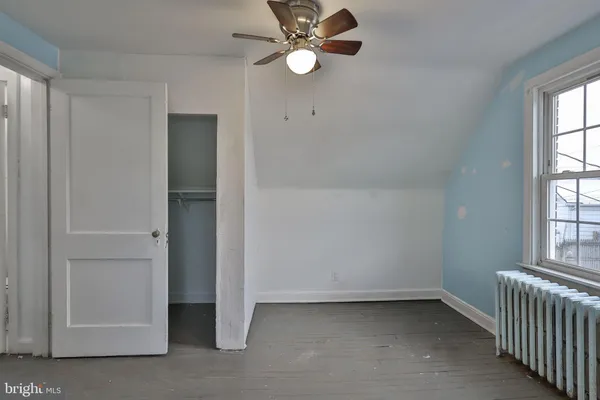 a bedroom with a bed and a cabinets