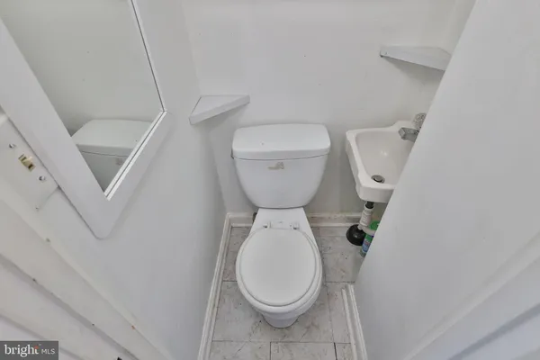 a bedroom with a bed and a television