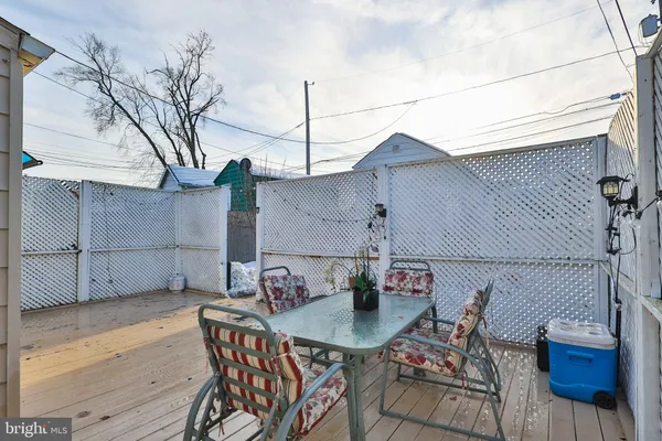 a front view of a house with sitting area
