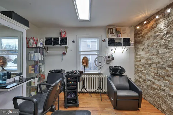 a work place with furniture and rug