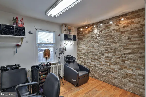 a room with furniture and gym equipment