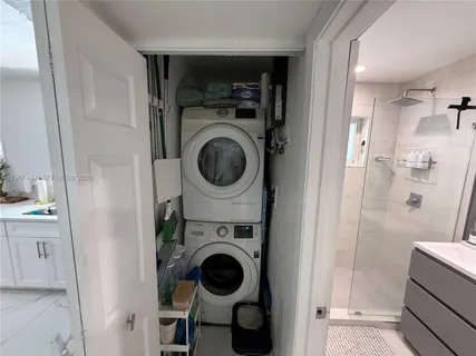 a view of a kitchen with washer and dryer