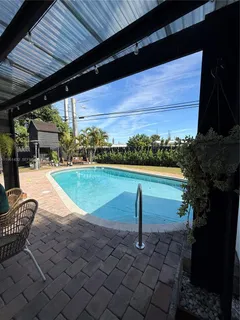a view of a swimming pool with a patio
