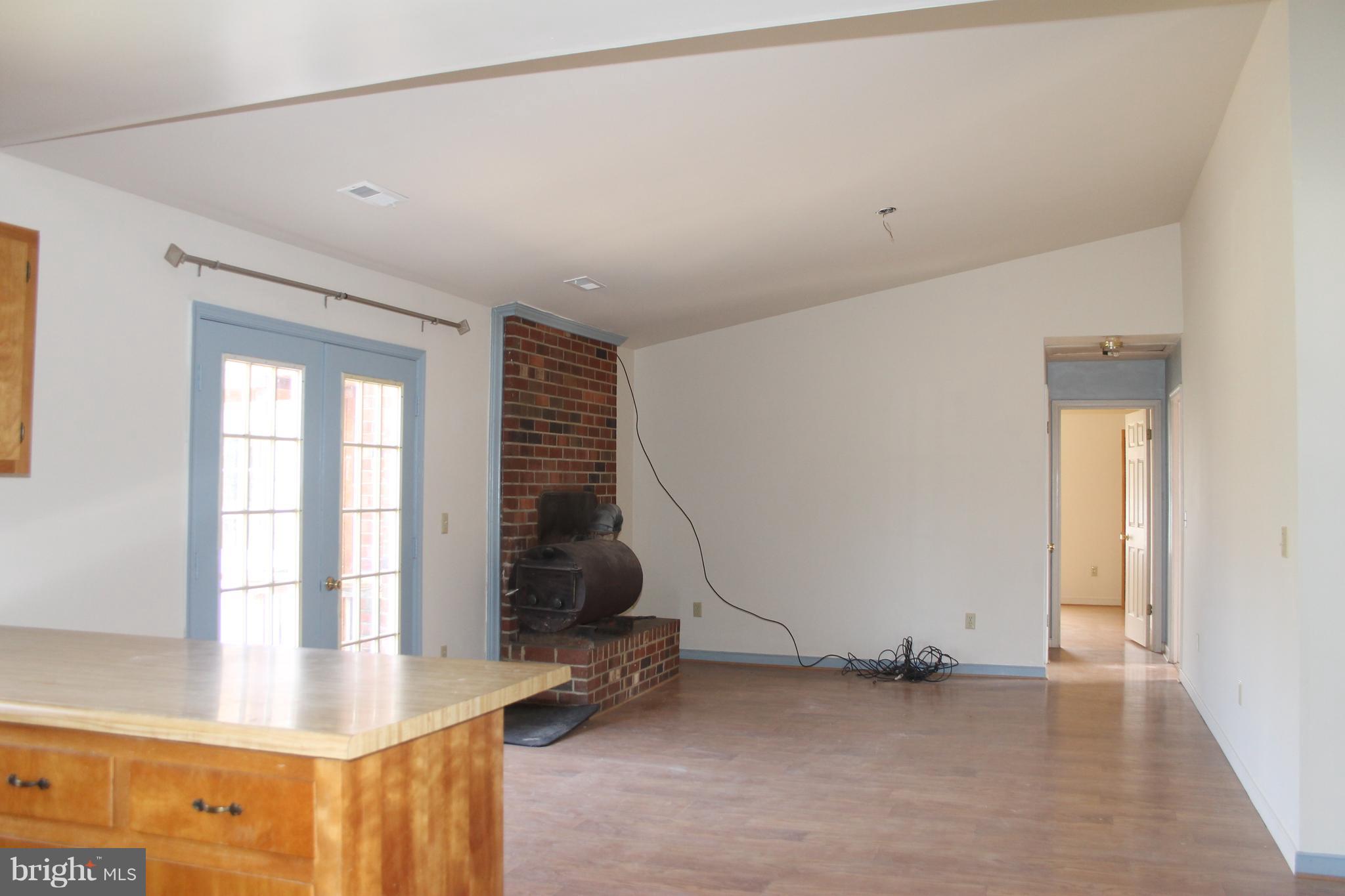 12009 Old Mill Road Midland, VA 22728 - Photo 8 of 27 Family Room has vaulted ceiling and FP with stove