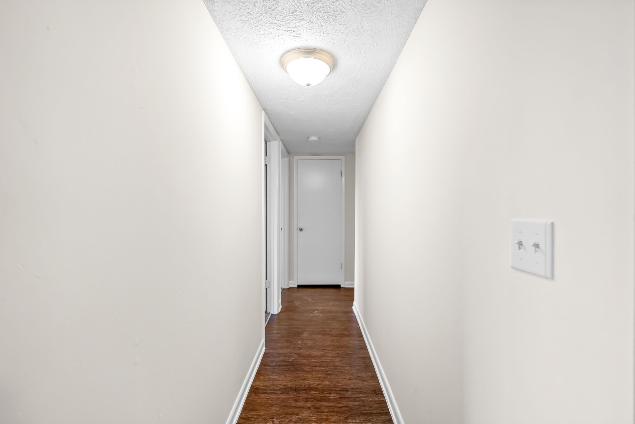 225 Clara Drive, Unit 2B Pembroke, KY 42266 - Photo 6 of 12 a view of a hallway with wooden floor