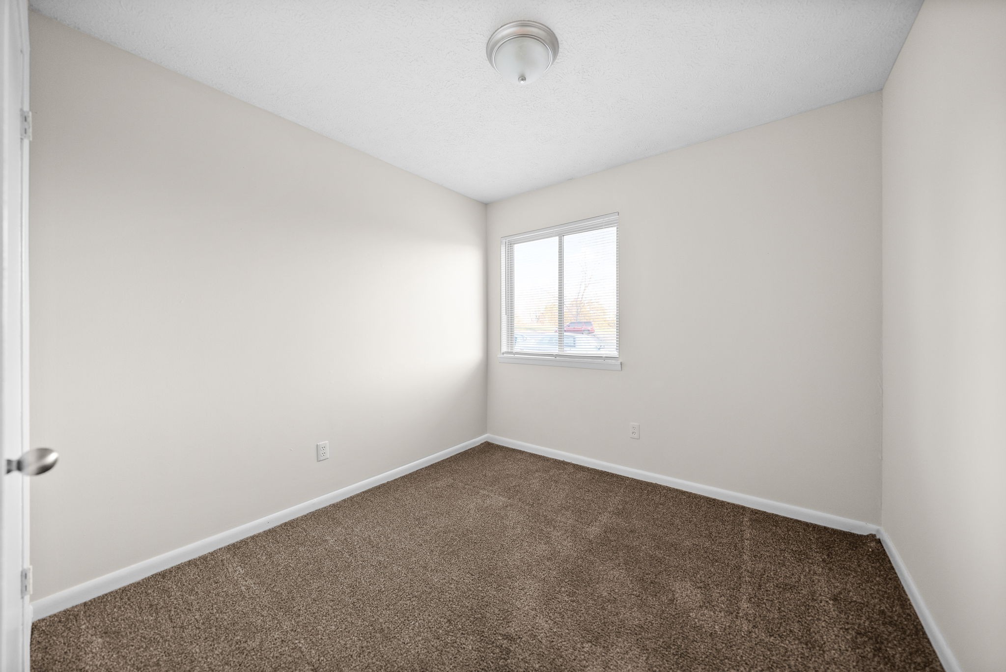225 Clara Drive, Unit 2B Pembroke, KY 42266 - Photo 7 of 12 an empty room with windows