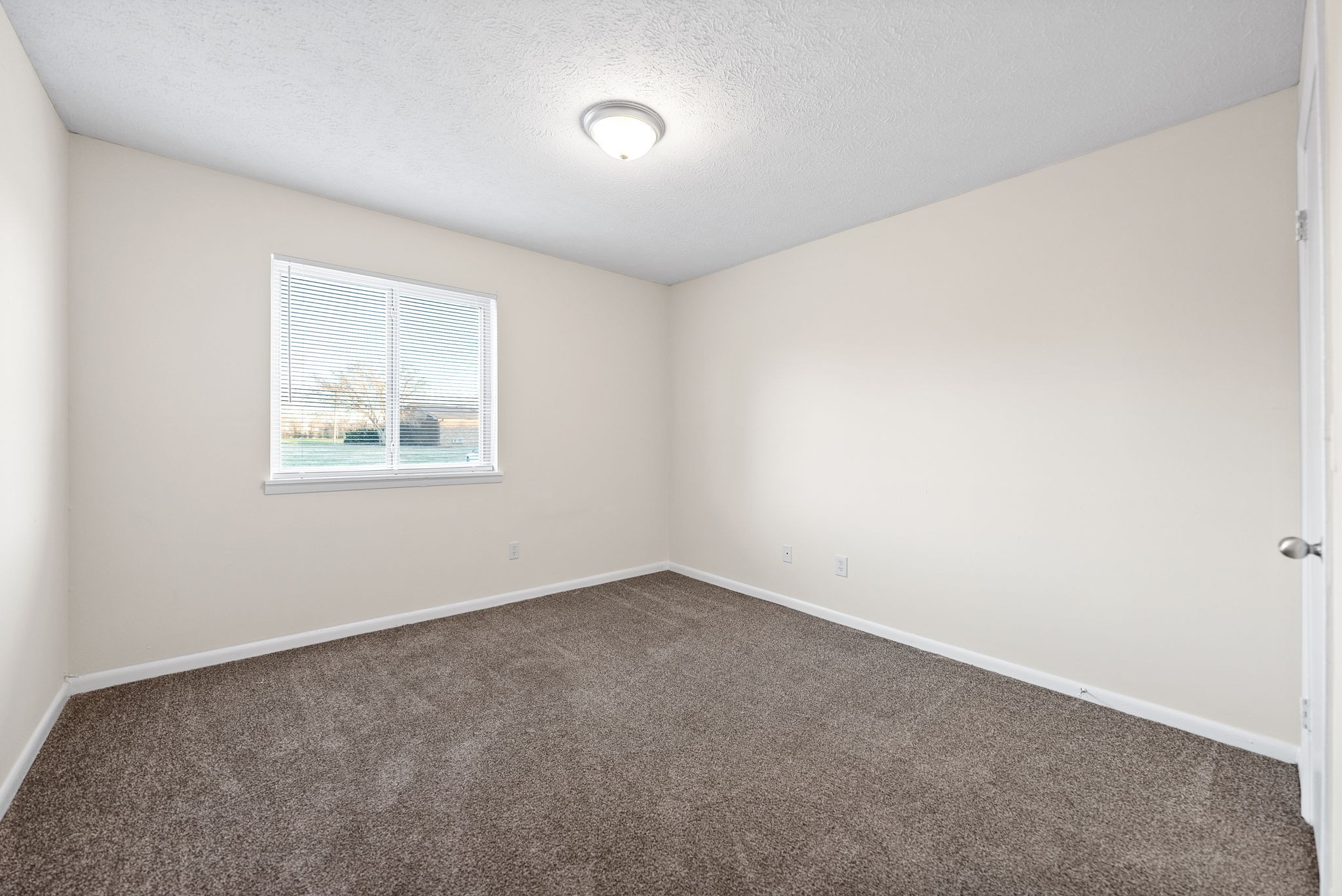 225 Clara Drive, Unit 2B Pembroke, KY 42266 - Photo 10 of 12 an empty room with a window