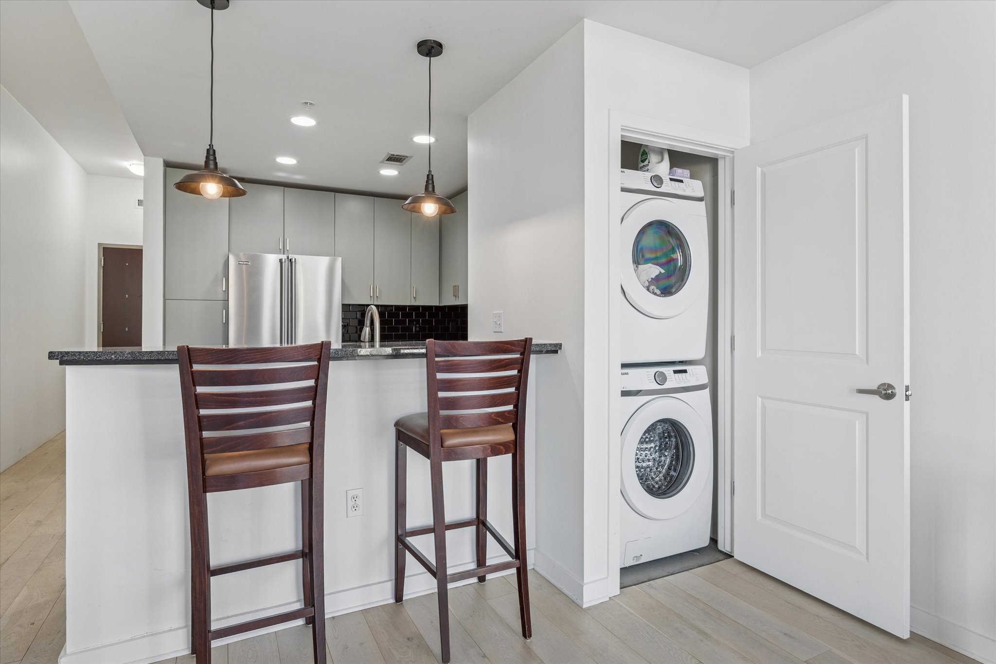 360 Nueces Street, Unit 1108 Austin, TX 78701 - Photo 11 of 31 a view of a kitchen with washer and dryer