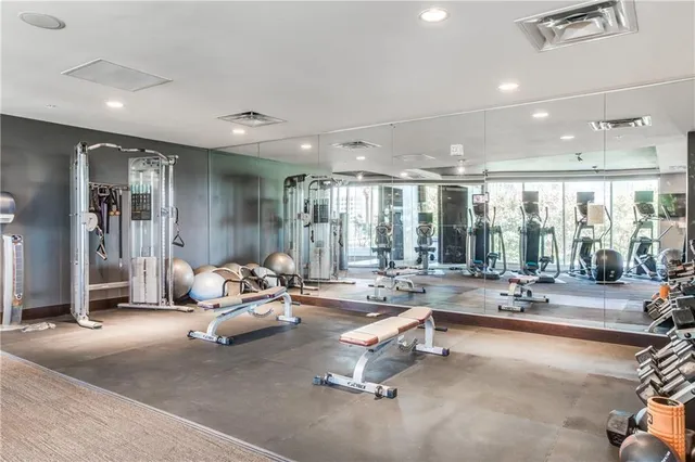 a view of the patio with dining table and chairs and plants