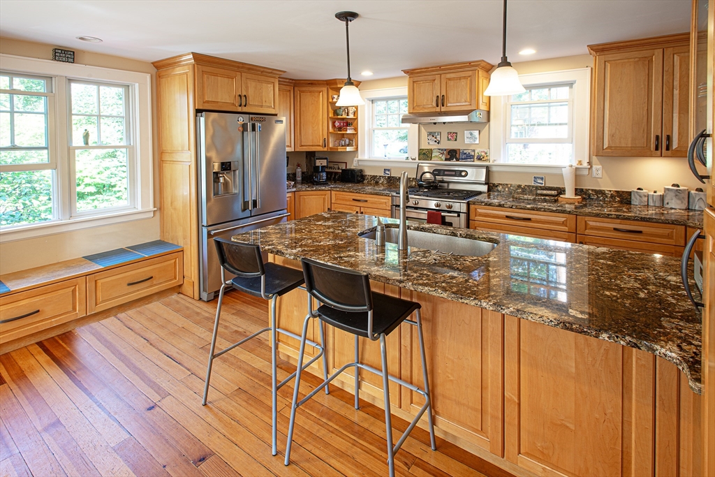 218 Elm Street Northampton, MA 01060 - Photo 13 of 42 a kitchen with stainless steel appliances granite countertop a stove and refrigerator