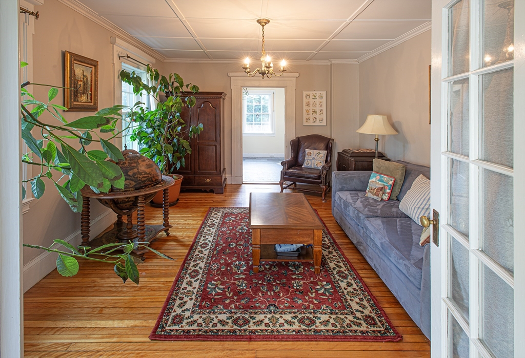 218 Elm Street Northampton, MA 01060 - Photo 24 of 42 a living room with furniture and a chandelier