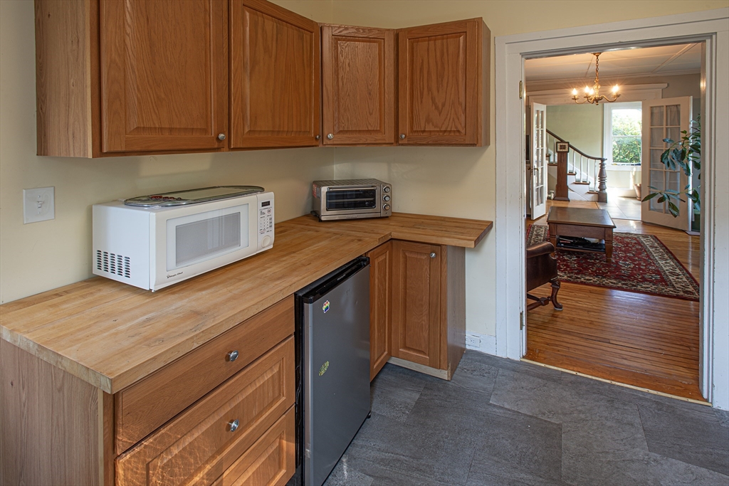 218 Elm Street Northampton, MA 01060 - Photo 27 of 42 a kitchen with stainless steel appliances granite countertop a stove a sink and a microwave