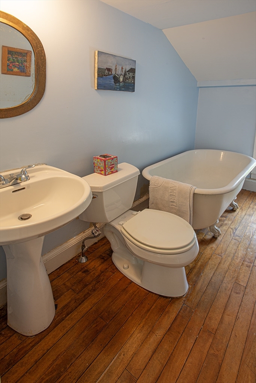 218 Elm Street Northampton, MA 01060 - Photo 38 of 42 a white toilet sitting next to a bathroom sink