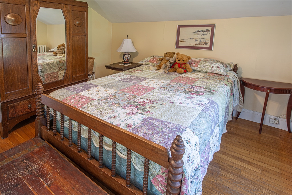 218 Elm Street Northampton, MA 01060 - Photo 41 of 42 a bedroom with bed and wooden floor