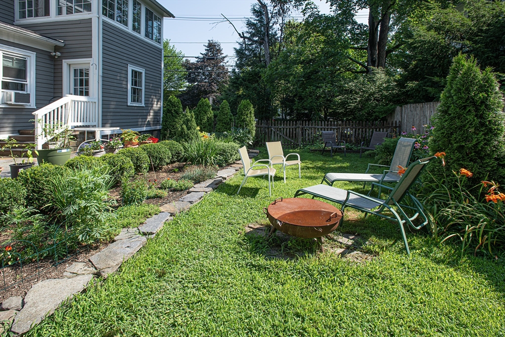 218 Elm Street Northampton, MA 01060 - Photo 6 of 42 a backyard of a house with outdoor seating