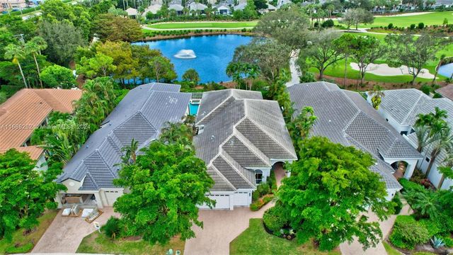 an aerial view of a house with garden space and street view