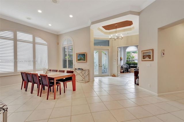 a bedroom with furniture and a flat screen tv