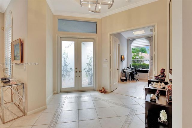 a bedroom with furniture and a flat screen tv