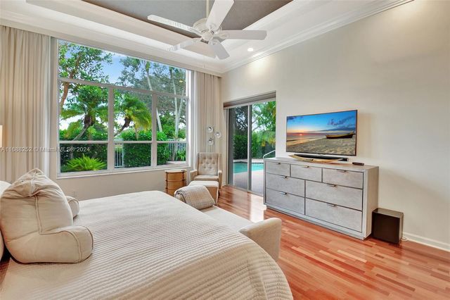 a view of a workspace with furniture and a bookshelf