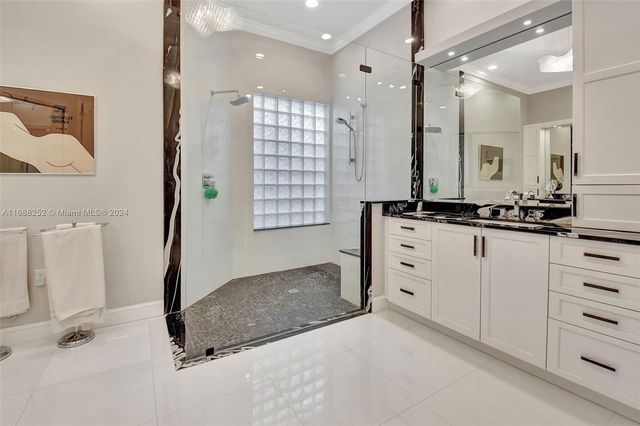a bathroom with a sink double vanity and a mirror