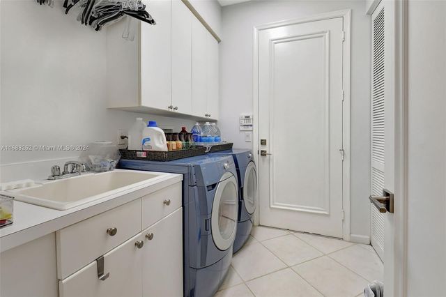 a view of a chairs and table in a patio