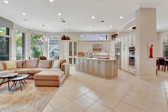 a kitchen with stainless steel appliances a stove a sink and a refrigerator