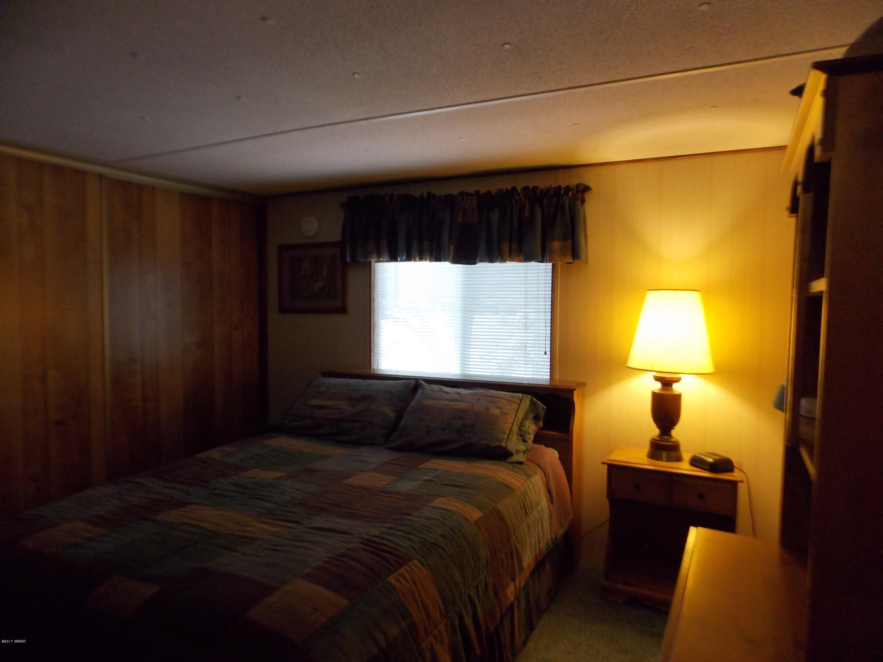 1978 Rustling Pine Drive Heber, AZ 85928 - Photo 11 of 21 a bedroom with a bed and a window