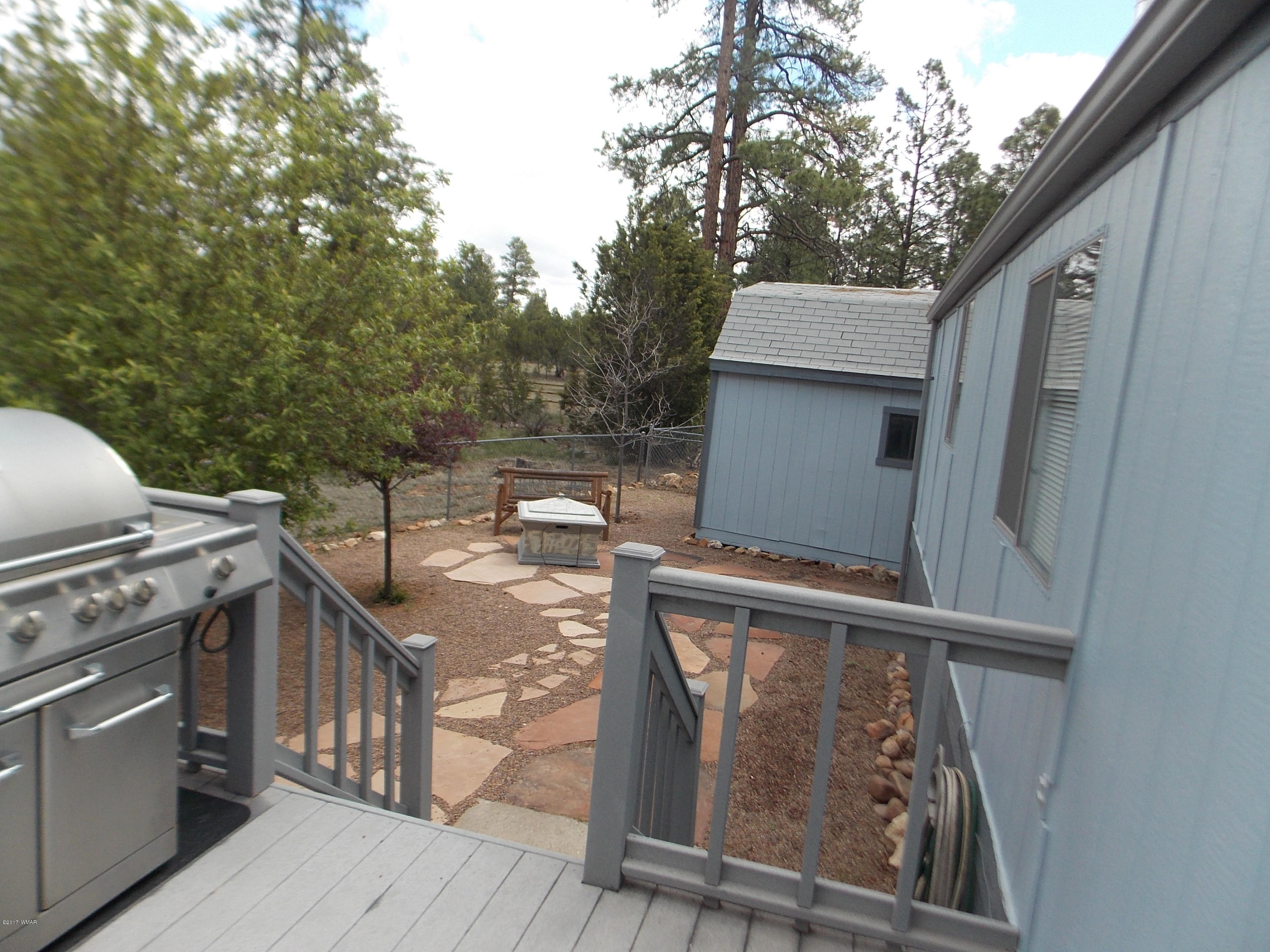 1978 Rustling Pine Drive Heber, AZ 85928 - Photo 15 of 21 a view of a balcony with wooden floor and stainless steel appliances