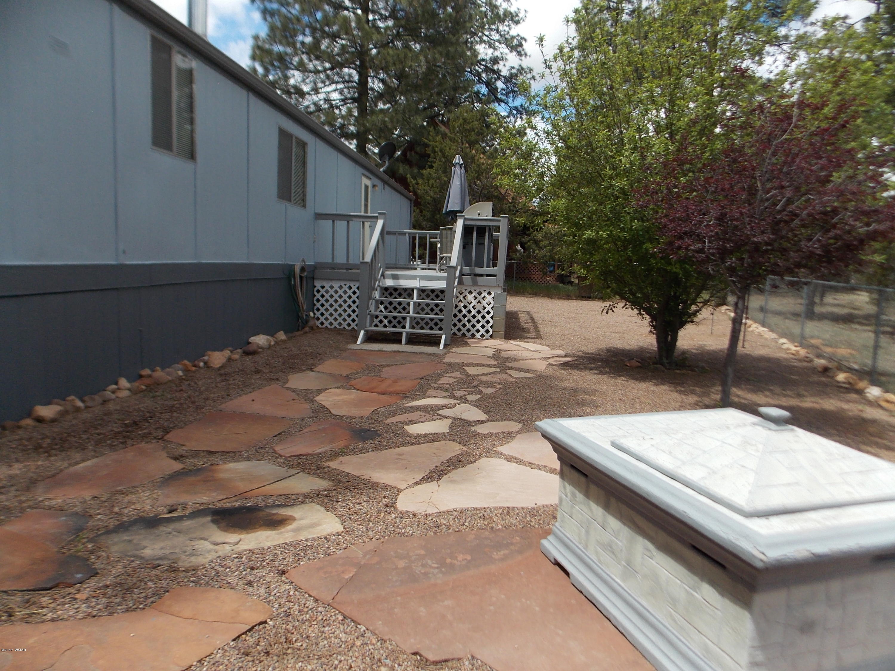 1978 Rustling Pine Drive Heber, AZ 85928 - Photo 18 of 21 a patio with table and chairs and potted plants