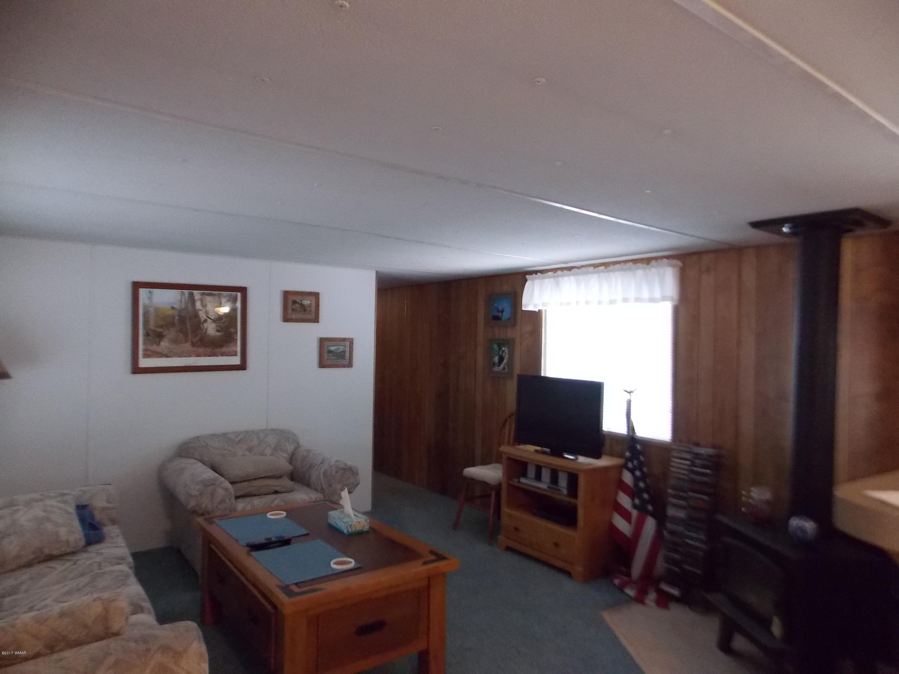 1978 Rustling Pine Drive Heber, AZ 85928 - Photo 2 of 21 a living room with furniture and a flat screen tv