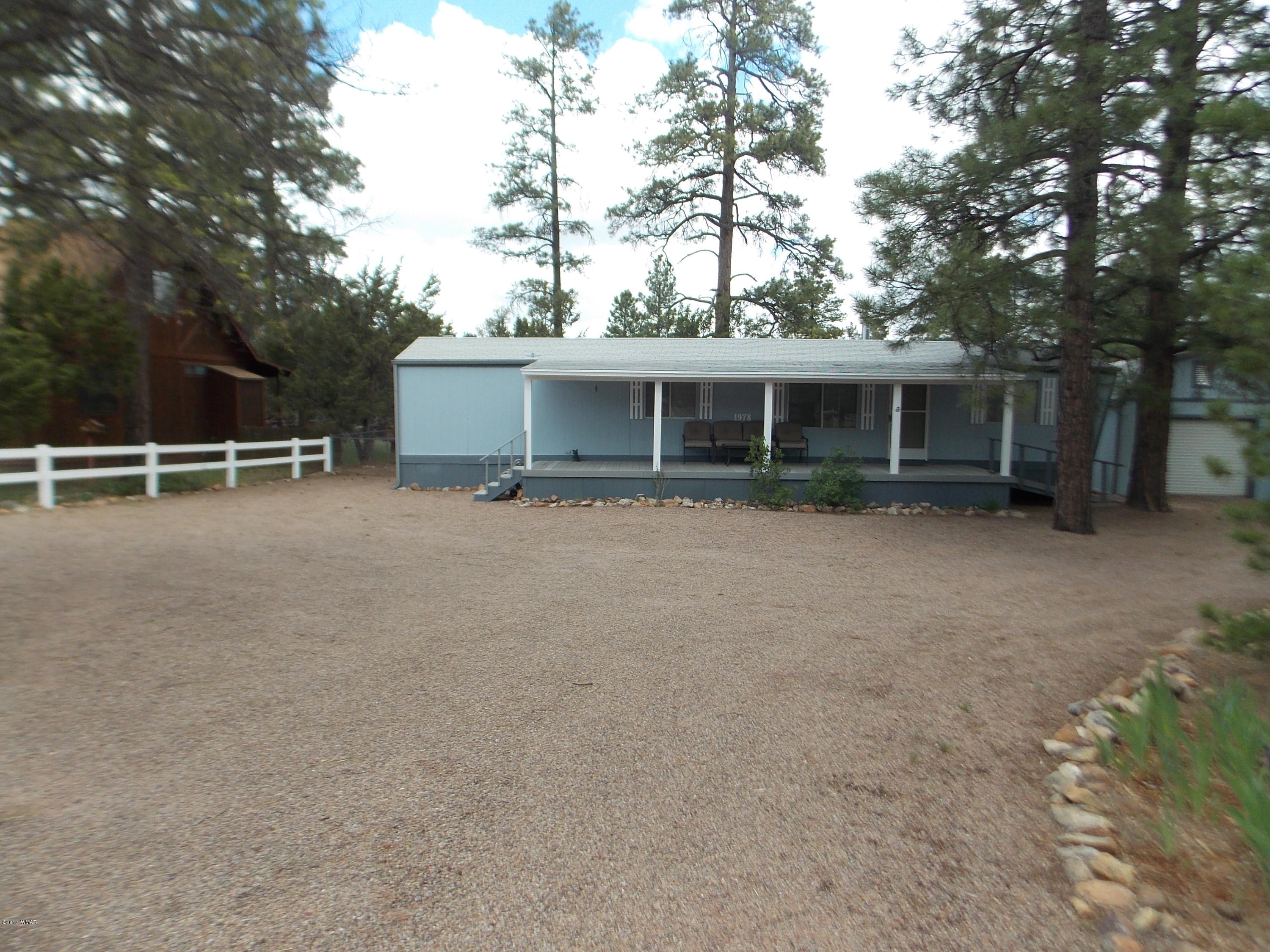 1978 Rustling Pine Drive Heber, AZ 85928 - Photo 21 of 21 front view of house with a yard and large trees