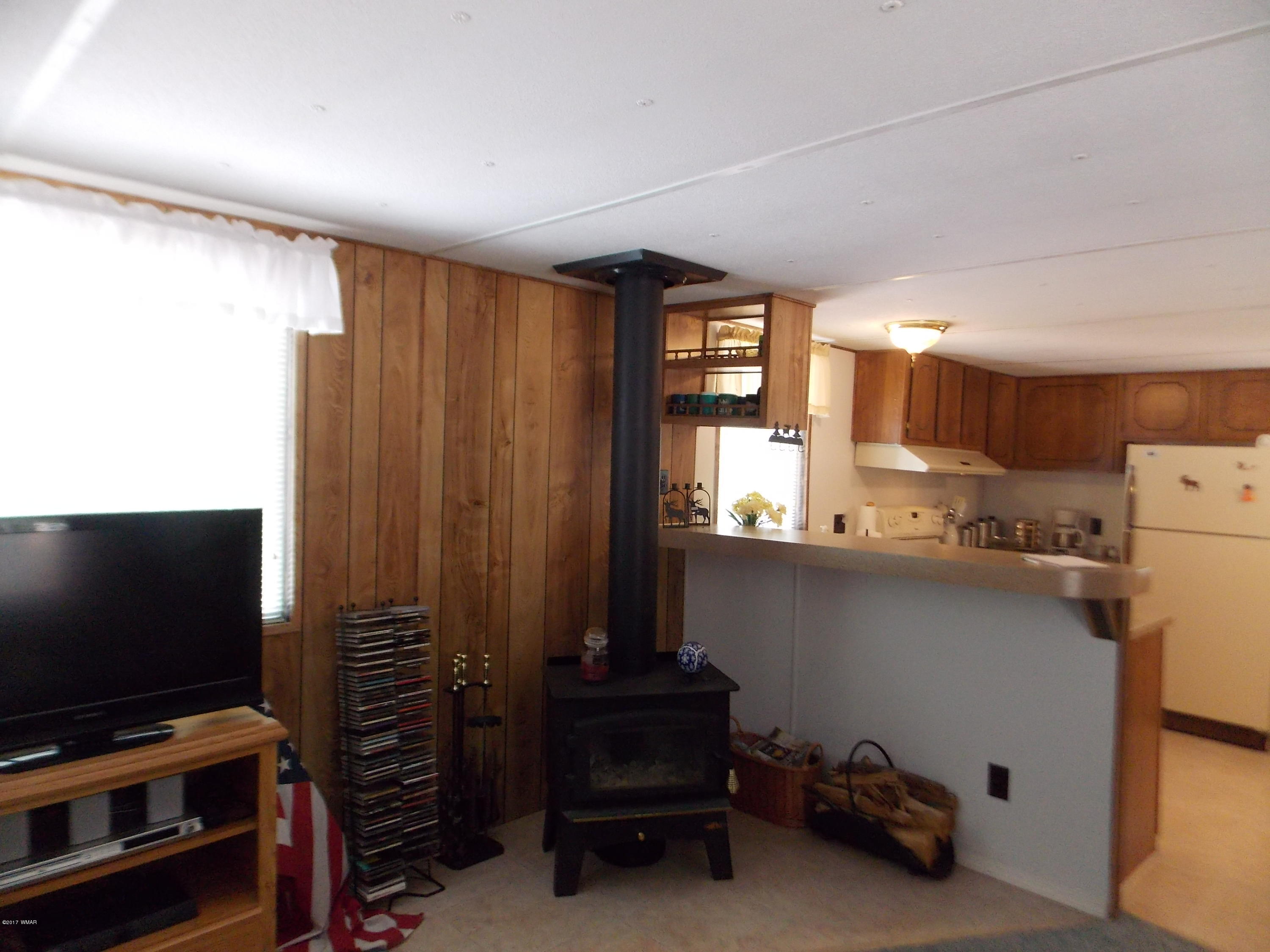 1978 Rustling Pine Drive Heber, AZ 85928 - Photo 4 of 21 a room with furniture and a flat screen tv