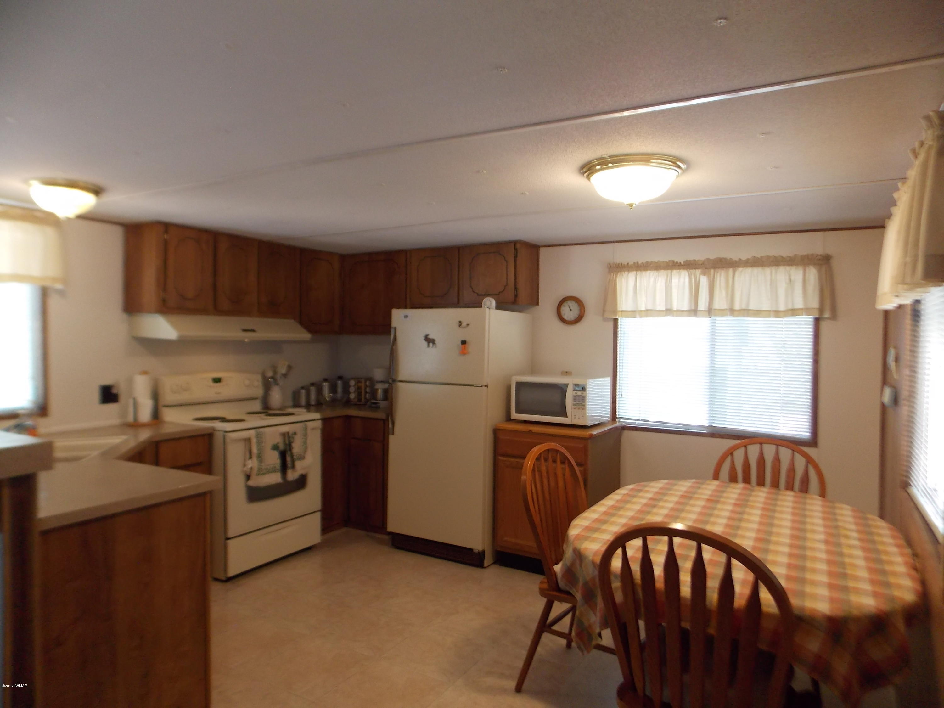 1978 Rustling Pine Drive Heber, AZ 85928 - Photo 7 of 21 a kitchen with refrigerator a stove a sink and a microwave