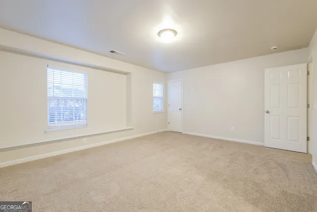 an empty room with windows