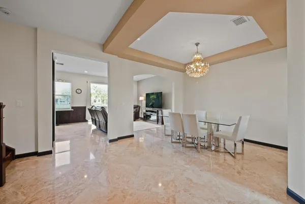 a front view of a house with a yard table and chairs