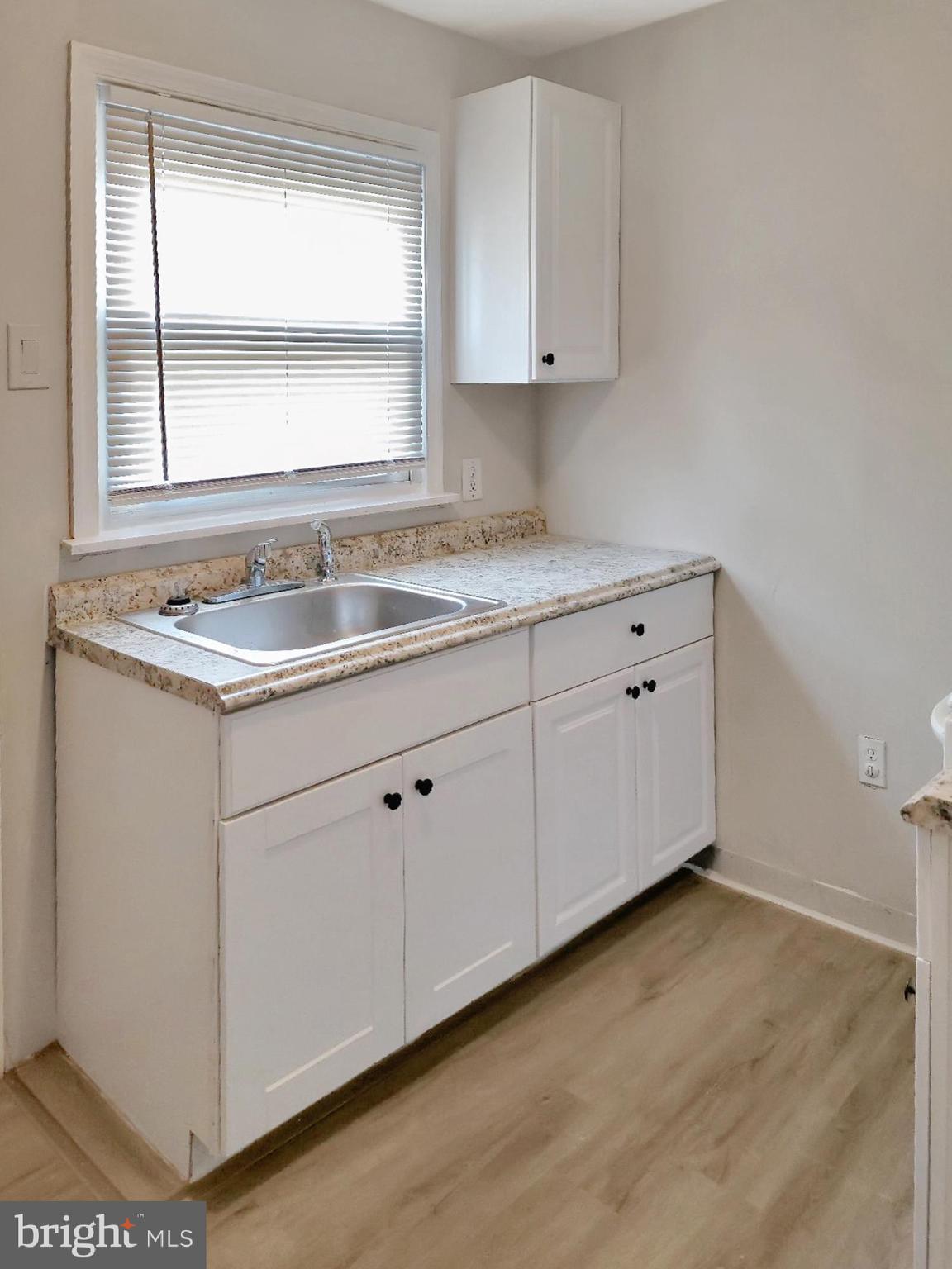 2015 Pierce Street Philadelphia, PA 19145 - Photo 3 of 15 a kitchen with a sink cabinets and window