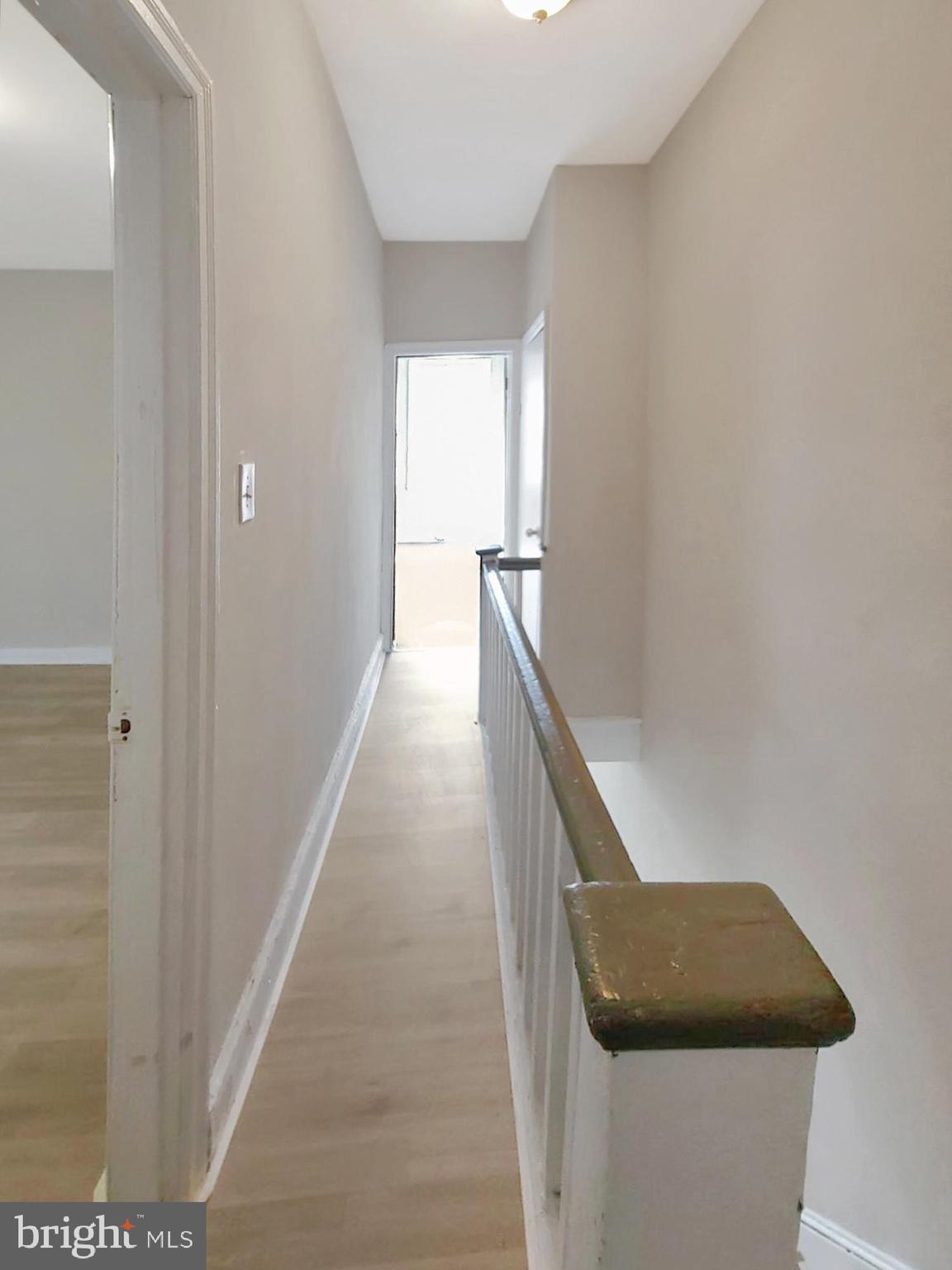 2015 Pierce Street Philadelphia, PA 19145 - Photo 6 of 15 a hallway with wooden floor and cabinet