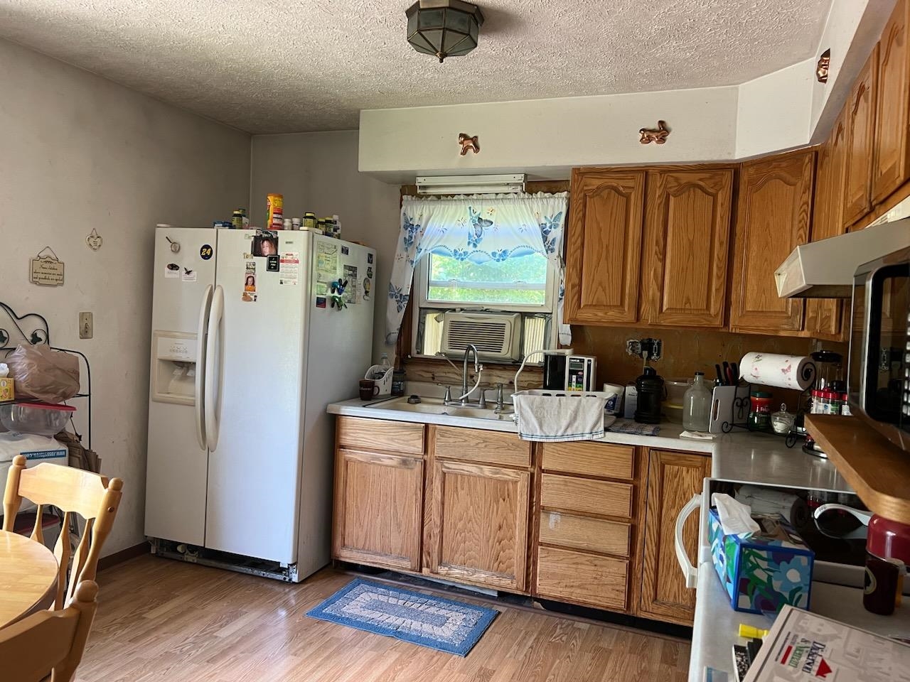 5773 East Brick Road Oregon, IL 61061 - Photo 3 of 7 a view of a kitchen with fridge and workspace