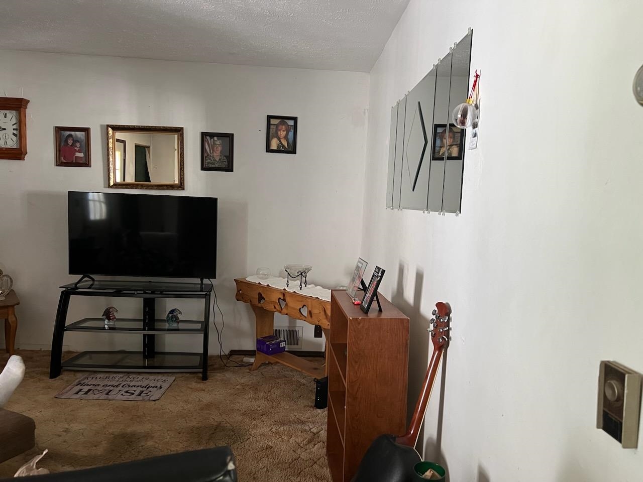 5773 East Brick Road Oregon, IL 61061 - Photo 5 of 7 a living room with furniture and a flat screen tv