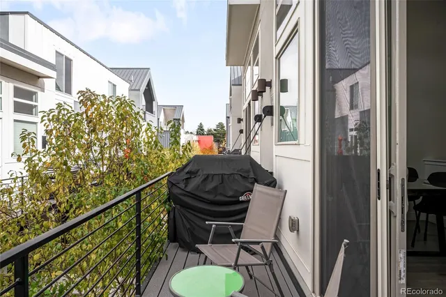 a view of balcony with furniture