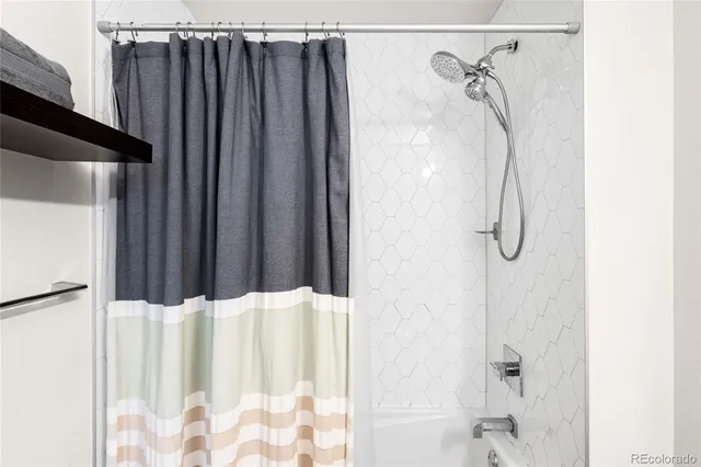 a bathroom with a shower curtain