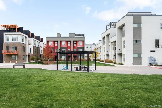 a view of a building with a yard